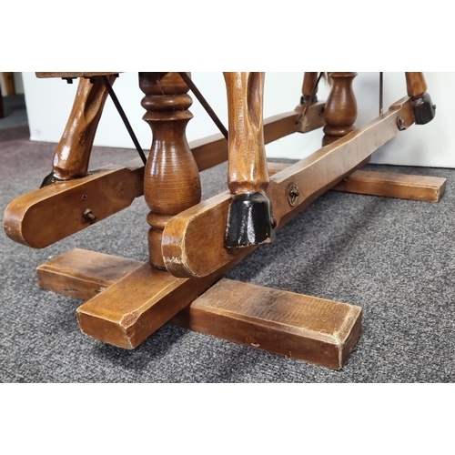 33 - Wooden rocking horse on trestle base, H: 86cm X W: 92cm X D: 46cm.