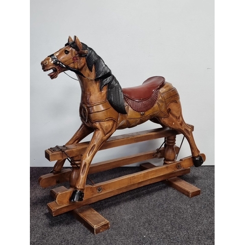 33 - Wooden rocking horse on trestle base, H: 86cm X W: 92cm X D: 46cm.