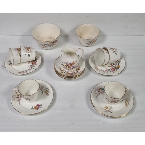 84 - Floral porcelain tea wares with gilt rims, registration mark R 43503