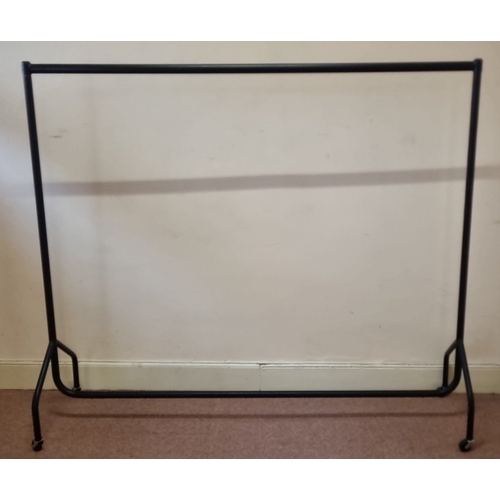 Tubular steel clothes rail on castors, H: 160cm X W: 185cm X D: 50cm.