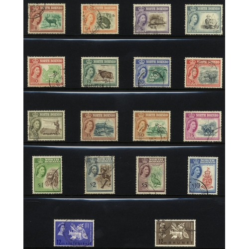 114 - BRUNEI, NORTH BORNEO, SARAWAK & MALAYA collection of VFU sets or short sets housed on black leaves i... 