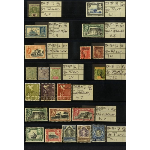 130 - EX DEALERS priced up mainly British Commonwealth material on black stock leaves, all items tagged wi... 