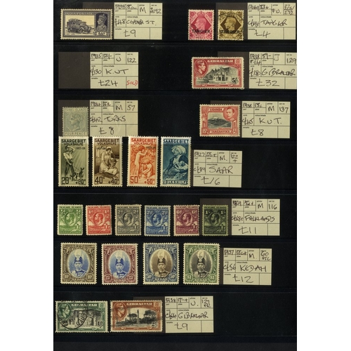 130 - EX DEALERS priced up mainly British Commonwealth material on black stock leaves, all items tagged wi... 