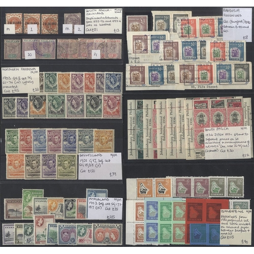 62 - EX-DEALER'S STOCK British Commonwealth material housed & priced on black stock cards with strength i... 