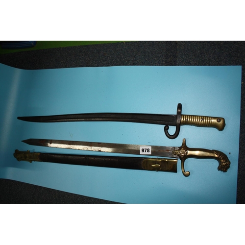 978 - Cased sword & 1 other 26