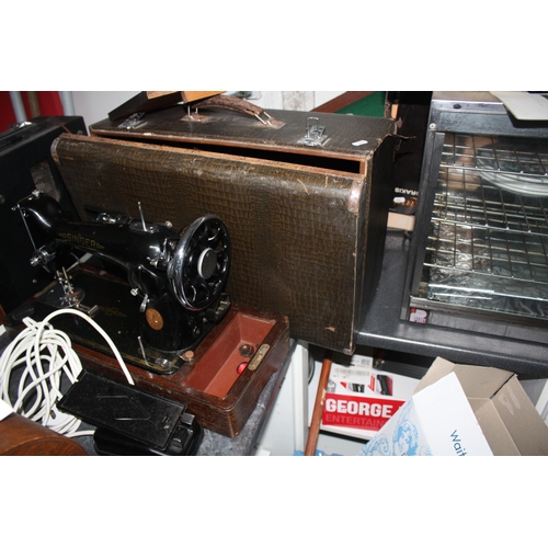 1290 - Cased electric Singer sewing machine