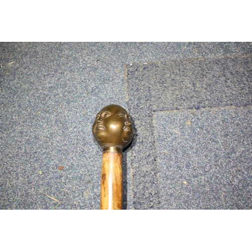 1342 - Walking stick with brass 4 faced handle 36