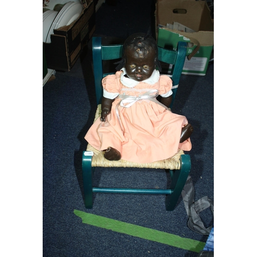 1430 - Plastic doll on childs chair 18 1/2