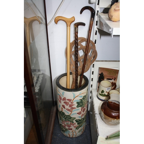 813 - China umbrella stand, walking sticks & carpet beater