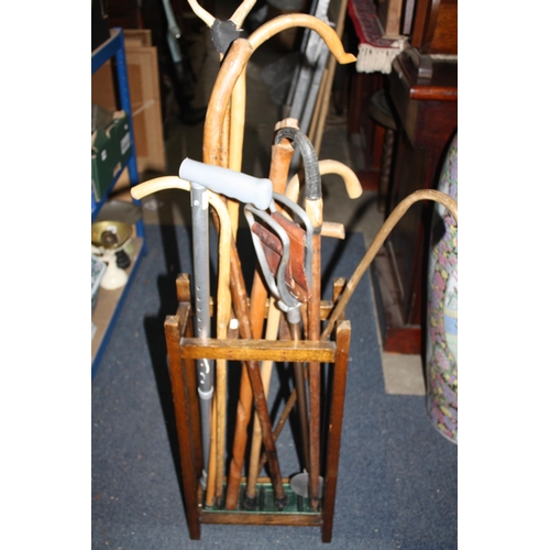 1502 - Oak stick stand with walking sticks, shooting stick etc