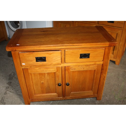 1798 - Oak 2 door 2 drawer sideboard- good condition apart from slight rubbing on left hand side.31