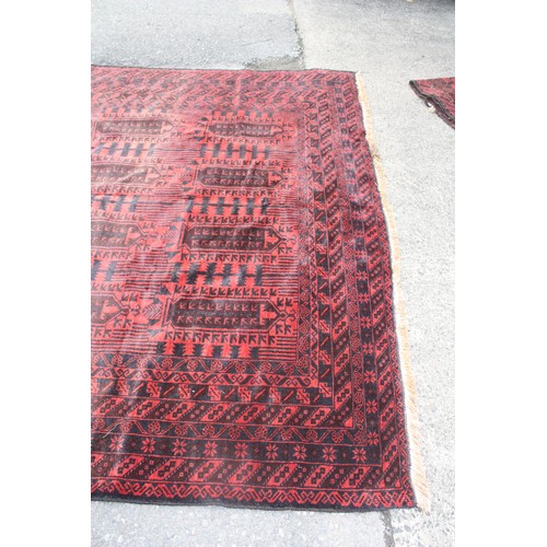 1902 - Red ground rug with 20 repeat motifs 2 metre 10 x 3 metre 40