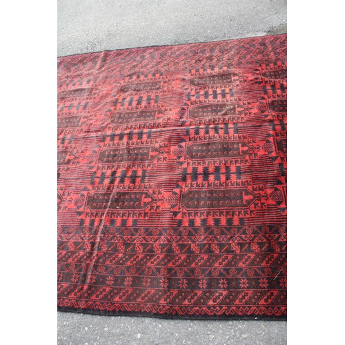 1902 - Red ground rug with 20 repeat motifs 2 metre 10 x 3 metre 40