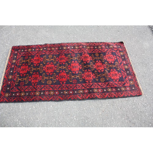 1902 - Red ground rug with 20 repeat motifs 2 metre 10 x 3 metre 40