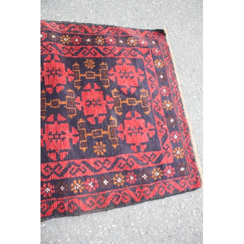 1902 - Red ground rug with 20 repeat motifs 2 metre 10 x 3 metre 40