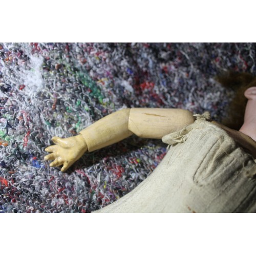 837 - Porcelain headed doll  marked Made in Germany 390 A.O.M - hairline crack from below ear to bottom of... 