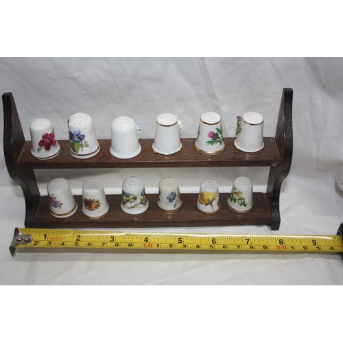 690 - Miniature shelf thimbles