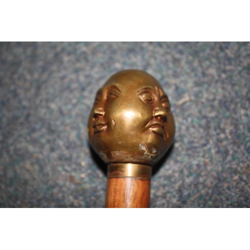 1099 - Brass 4 faced head walking stick 36