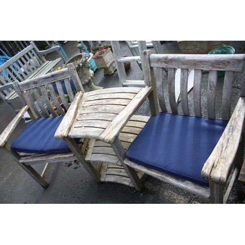 32 - Garden love seat with blue cushions- slight wear to 1 arm overall w. 69