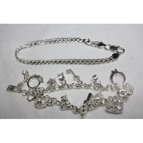 1118 - Silver overlay charm bracelet & curb bracelet