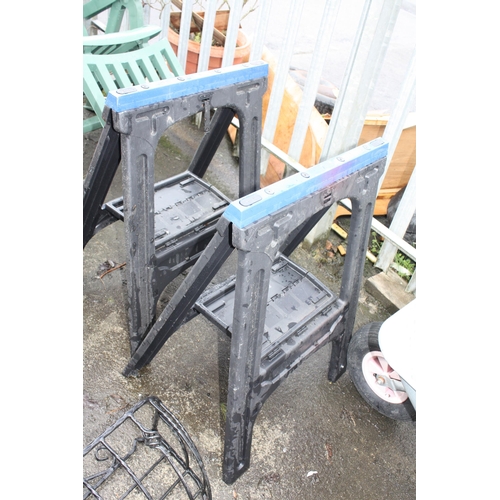 145 - 2 folding plastic trestles