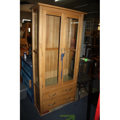 1695 - Oak 2 door 2 drawer bookcase with 3 glass shelves 71