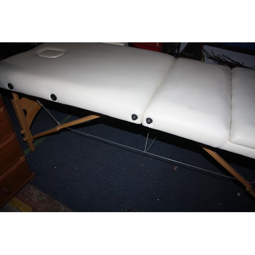 382 - Massage couch- odd small mark/scuff