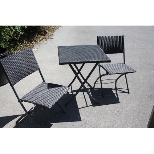 130 - Folding rattan bistro table 24