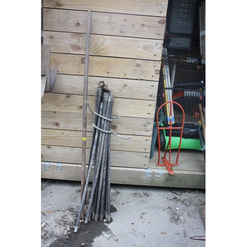 239 - Set drain rods & 5' iron bar