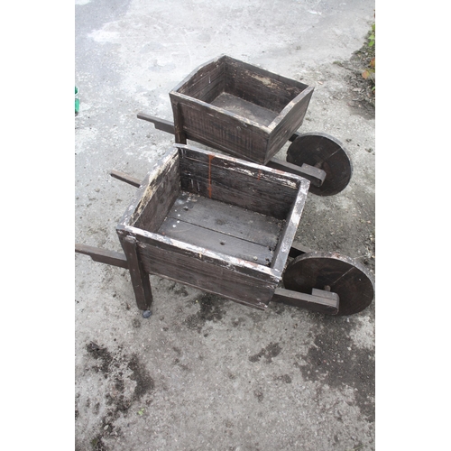 36 - 2 ornamental wooden wheelbarrows 16