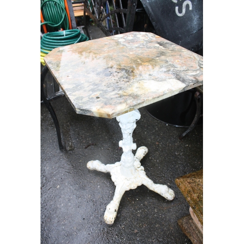 112 - Marble topped garden table on iron base 27