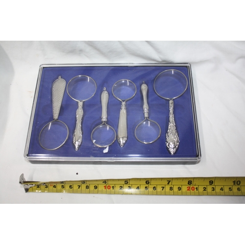 295 - Cased set magnifying glasses