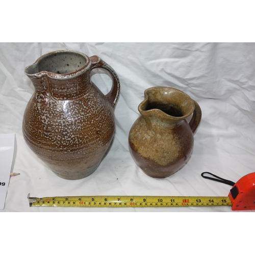 299 - 2 pottery jugs tallest 10