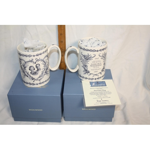 338 - 2 boxed Wedgwood commemorative mugs tallest 4 3/4