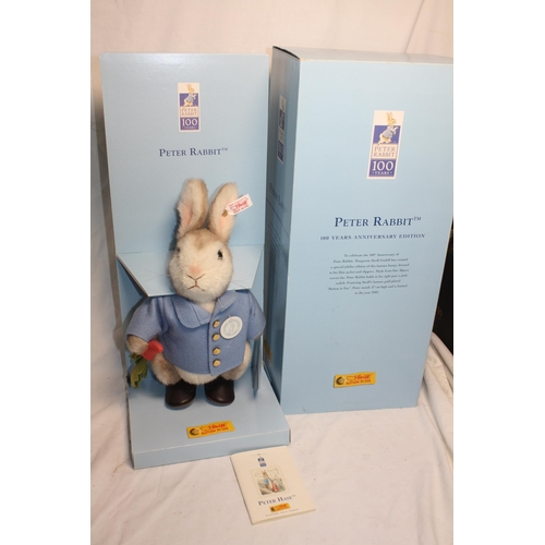 555 - Boxed Steiff Peter Rabbit with gilt button 13