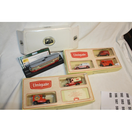 581 - 2 boxed Unigate models & tram