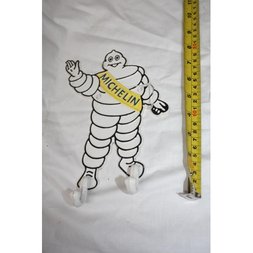 788 - Michelin man iron coat hanger