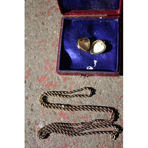 1630 - 9Ct gold back & front heart locket 3.4 grams all in and a metal chain