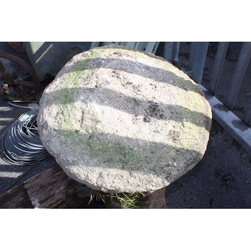 48 - Granite saddle stone on square base 67cm height,
55cm diameter of top