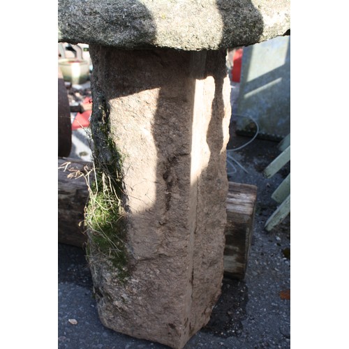 48 - Granite saddle stone on square base 67cm height,
55cm diameter of top