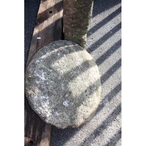 49 - Granite saddle stone 89cm height, 57cm diameter