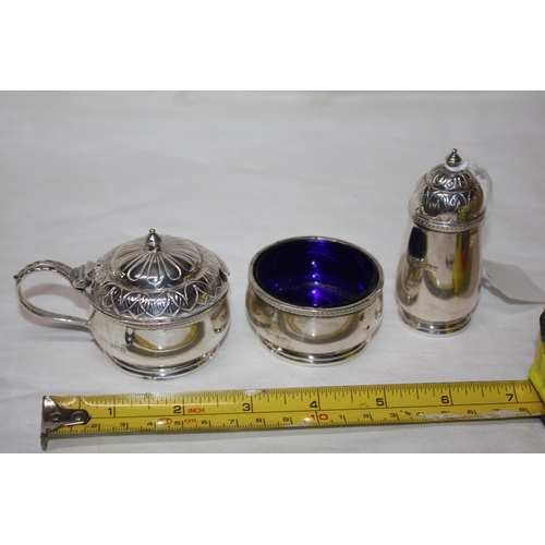 1130 - Walker & Hall embossed silver 3 piece cruet set 284 grammes weighable- 2 blue glass liners