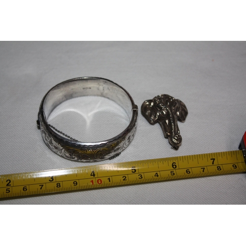 1225 - Heavy silver snap bangle 26.7 grammes & white metal elephant brooch