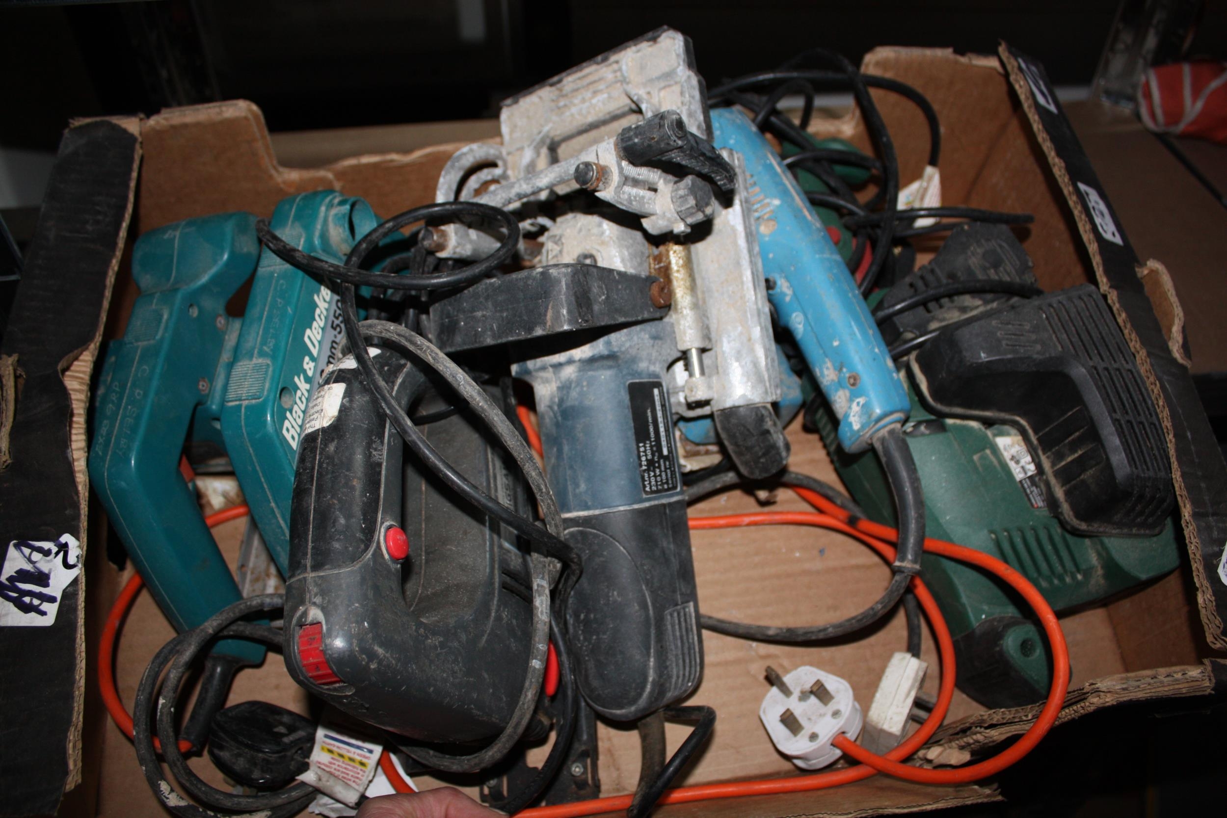 Box of assorted power tools