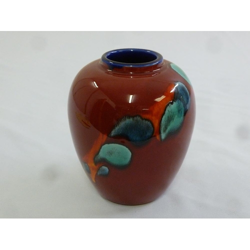 108 - A Poole Pottery vase with abstract designs to the sides, marks to the base