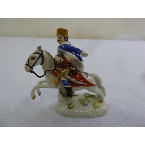 114 - A Meissen figurine of a Cossack on horseback, marks to the base, 7.5cm (h)