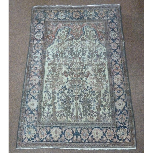 25 - A Persian wool carpet, brown ground with tree of life design and floral border, 198.5 x 134cm