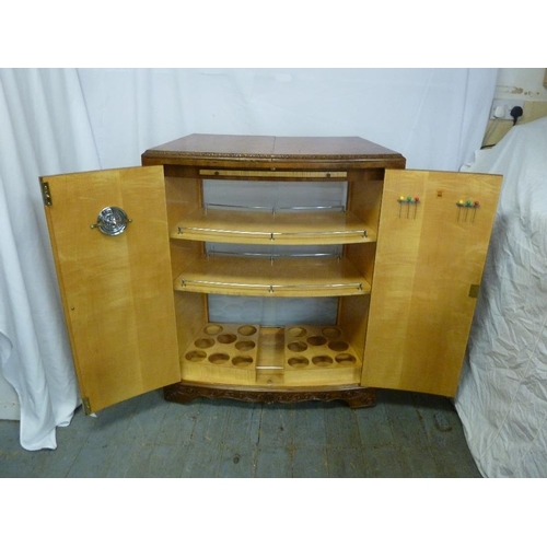 3 - A 1960s walnut veneered bar with hinged doors revealing galleried shelves and extending counters