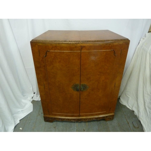 3 - A 1960s walnut veneered bar with hinged doors revealing galleried shelves and extending counters