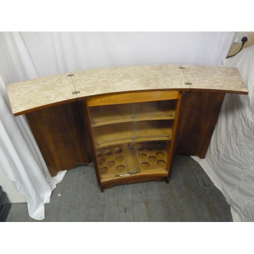 3 - A 1960s walnut veneered bar with hinged doors revealing galleried shelves and extending counters